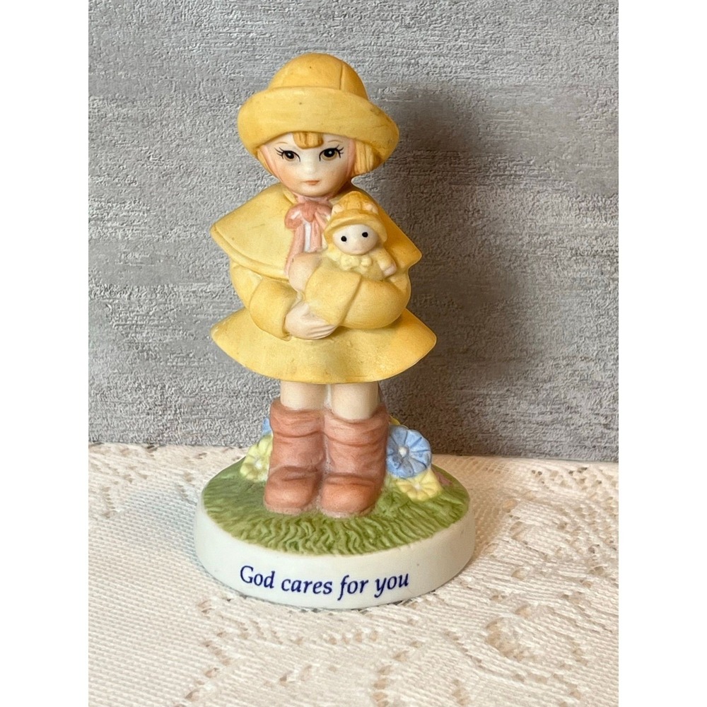 Lefton GCFY little girl figure yellow‎ rain coat -reads God cares for you.